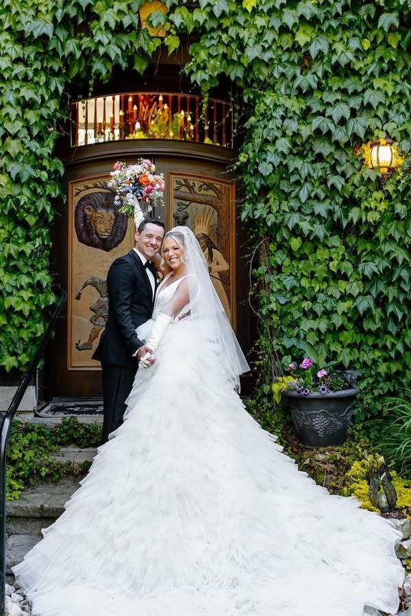 White Trendy Deep V-Neck Tiered A-Line Tulle Wedding Dresses with Cathedral Train